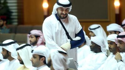 Injured Mohammed Al Mansoori, 37, goes up to receive his award for helping out during the storm. Delores Johnson / The National