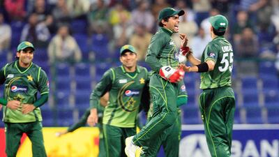 Pakistan's Umar Akmal celebrates the dismissal of England batsman Ravi Bopara in the second Twenty20 match in Abu Dhabi on February 27, 2012. Ravindranath K / The National