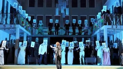 Alfred Kim, with his back to the camera, performs at Frankfurt Opera House, Germany, during a dress rehearsal for Les Vepres Siciliennes. AP Photo / Thilo Beu, Oper Frankfurt