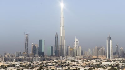The Burj Khalifa, centre, and Dubai World Trade Centre have had an earthquake-detection system installed. Reem Mohammed / The National