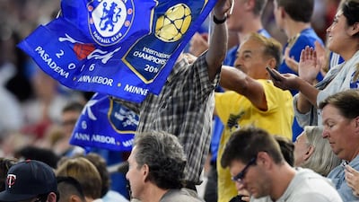 A Chelsea fan waves a flag during the game. Hannah Foslien / Getty Images
