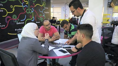 Ehab Kahwati explains how to create remotely controlled technology using his Drag IoT kits, which contain a variety of gadgets and wires. Courtesy Moataz Al Smara