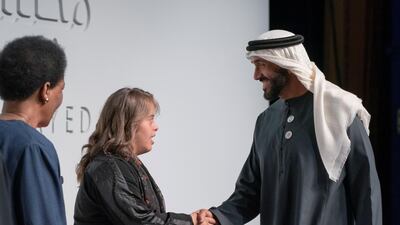 Sheikh Nahyan Bin Zayed, Chairman of the Board of Trustees of Zayed bin Sultan Al Nahyan Charitable and Humanitarian Foundation (R), greets Special Olympics athlete, Chaica Al Qassimi (2nd L), after a lecture by Loretta Claiborne, Chief Inspiration Officer, Vice Chair of the Special Olympics International Board of Directors (L), titled "Changing the Game for Inclusion", at Emirates Palace. Ryan Carter / Ministry of Presidential Affairs