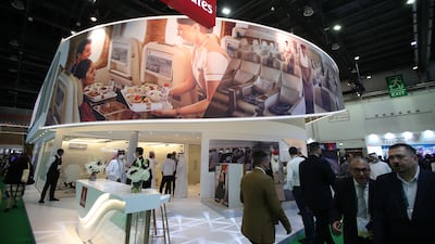 Visitors gather at the Emirates stand at the Arabian Travel Market in Dubai. EPA