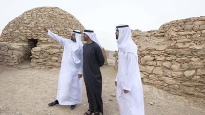 Sheikh Mohamed bin Zayed, Crown Prince of Abu Dhabi and Deputy Supreme Commander of the UAE Armed Forces (C) inspects Jebel Hafeet tombs. Seen with Mohamed Khalifa Al Mubarak, Chairman of the Department of Culture and Tourism and Abu Dhabi Executive Council Member (L) and Saif Ghobash, Director General of Abu Dhabi Tourism and Culture Authority (R). Mohammed Al Blooshi
