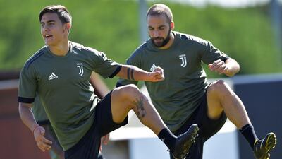 Juventus' Argentina forwards Paulo Dybala, left, and Gonzalo Higuain. Marco Bertorello / AFP