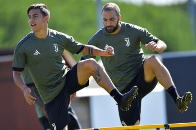 Juventus' Argentina forwards Paulo Dybala, left, and Gonzalo Higuain. Marco Bertorello / AFP