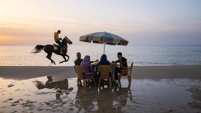 Palestinians enjoy a day on the beach in Gaza City. AP Photo