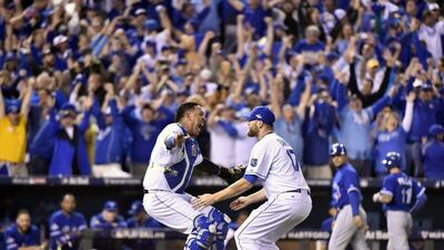 Kansas City Royals catcher Salvador Perez, left, and relief pitcher Wade Davis celebrate after defeating the Toronto Blue Jays in Game 6 of the American League Championship Series on Friday, Oct. 23, 2015, in Kansas City, Mo. The Royals won 4-3. Nathan Denette/The Canadian Press