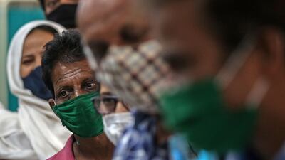 Beneficiaries wait for their turn to get her first dose of a Covid-19 vaccine shot, manufactured by Serum Institute of India, inside Vaccination Centre at Shatabdi Hospital in Mumbai, India. EPA