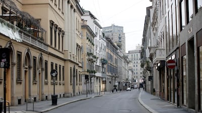 A view of a deserted street in downtown Milan. AP Photo