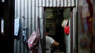 While there is no exact record of the number of rooftop residents, there are more than 170,000 substandard homes throughout the city, according to authorities. Anthony Wallace/AFP Photo