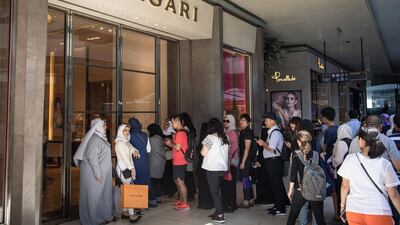 People line up outside a Bvlgari store to take advantage of low prices at the Zorlu luxury shopping mall in Istanbul. Chris McGrath / Getty