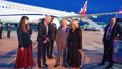 The UK's ambassador to the Holy See, Christopher Trott, second left, greets the royal couple. Getty Images