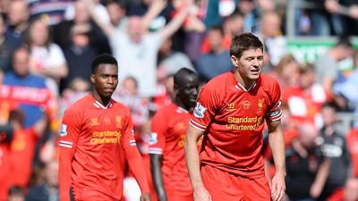 Steven Gerrard, right, and his Liverpool teammates react with dejection after allowing the second goal in a 2-0 Premier League loss to Chelsea at Anfield Stadium on April 27, 2014. Simon Bellis / Sportimage