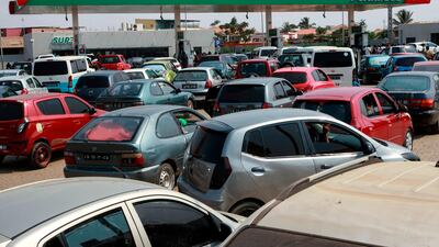 Cars at a petrol station in Luanda, Angola, one of Africa's leading oil producers. AFP