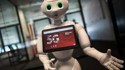 Robot 'Pepper' welcomes guests arriving for the opening of the Vodafone 5G Lab in Dusseldorf on May 9, 2018. AFP