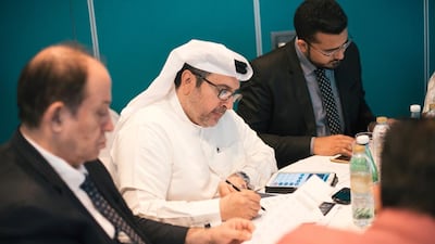 Issa Ahmed Alhashimi, vice president of Business Istanbul Healthcare, writes notes. Alex Atack for The National.