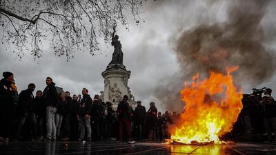 epa07214688 A trashcan burns on Place de la Republique as students demonstrate against the increase of the subscription fees for foreigners students, in Paris, France, 07 December 2018. This movement takes place while the government is facing a major contestation by the so called movement of the Gilets Jaunes (Yellow Vests). EPA/IAN LANGSDON