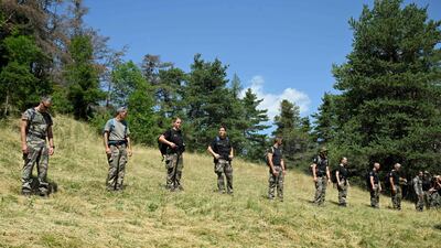 French gendarmes take part in the July 10 search operation for Emile, 2, who is missing in the French Alps village of Haut-Vernet. AFP
