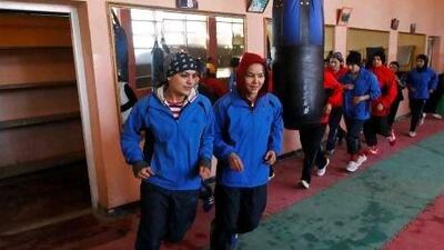Afghan boxer Sadaf Rahimi, left, at a training session in Kabul. Rahimi is the only woman in her country's delegation of six to the Games. Reuters / Omar Sobhani