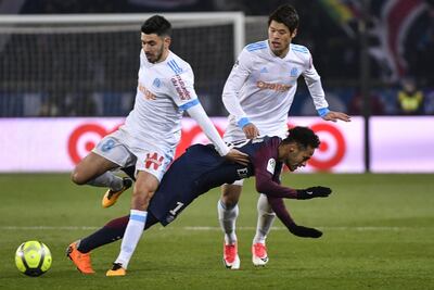 Paris Saint-Germain forward Neymar vies with Marseille midfielder Morgan Sanson, left, and defender Hiroki Sakai. Gerard Julien / AFP