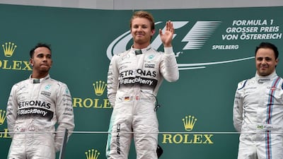 Nico Rosberg, centre, stands atop the Austrian Grand Prix podium, with teammate Lewis Hamilton, left, second, and Williams' Felipe Massa in third. Andrej Isakovic / AFP / June 21, 2015