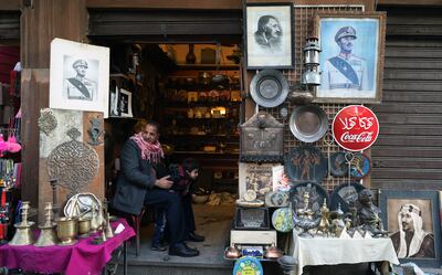 An Egyptian selling crafts and photographs of presidents and kings on Elmoez Lideen Ella street in Old Cairo. EPA