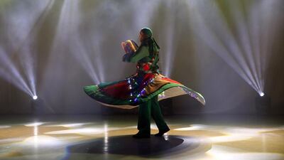 A dancer of the Syrian al-Mohra Group for Folks Arts perform during an operetta titled 'Raj’een' or 'We will come back' at the al-Hamra theatre in Damascus, Syria. EPA
