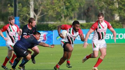 Kini Natuna, centre, scored two of the UAE's eight tries as they swept Thailand 50-12 in the Asia Rugby Championship Division 2 final on Saturday. Courtesy of Asia Rugby