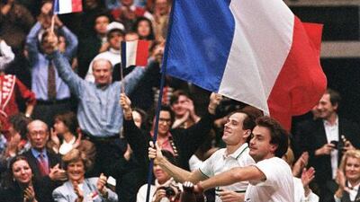 France’s Guy Forget, left, and Henri Leconte celebrate winning the Davis Cup final against the United States at Lyon in France in December 1991. Forget defeated Pete Sampras to clinch the title. AFP