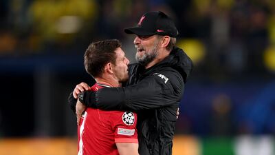 Jurgen Klopp embraces James Milner after Liverpool's victory over Villarreal in the Champions League semi-final. Getty