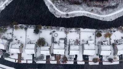Snow falls on a neighborhood on Halloween in Round Lake Heights, Illinois, USA. EPA