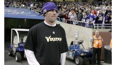 Brett Favre looks out over Ford Field in Detroit on Monday night after he was inactive for the Vikings against the Giants, ending his 297-game streak.