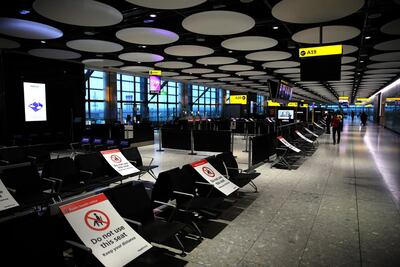Empty passenger waiting seats at Heathrow Terminal 5 Airport in London. Mandatory quarantine policy on arrival at some destinations has dented recovery prospects of the travel and tourism industry. Getty Images