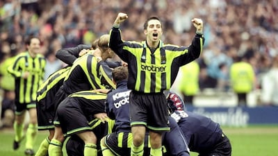 Manchester City players celebrate in 1999 after beating Gillingham on penalties to win the Division Two play-off in England's third tier on penalties. They had been 2-0 down in normal time and scored twice in stoppage time to save themselves. All images from Allsport