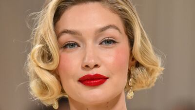 Gigi Hadid in Chopard jewellery with a Thom Browne gown. AFP