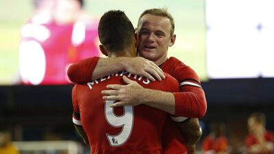 Wayne Rooney, right, and Memphis Depay will have major parts to play if Manchester United are to thrive this season. Stephen Lam / Getty