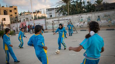 Girls play football in the Northern Gaza town of Beit Lahiyah. Women in Gaza typically do all types of sports till the age of 16, when family pressure forces them to stop as many families seek to find husbands for them.