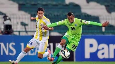 Ciel (green) of Shabab controls the ball during the Asian Championship League match against Pakhtakor (Uzebkistan) (white/yellow) in Dubai on Tuesday, March 12, 2013. (Ashraf Umrah / Ittihad)