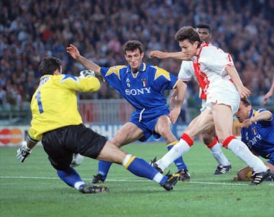 Jari Litmanen, of Ajax, right puts the ball past Juventus goalkeeper Angelo Peruzzi to score in the 1996 Champions League final at Stadio Olimpico in Rome. AP Photo