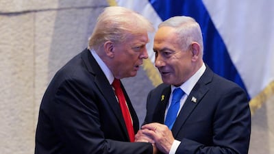 President Donald Trump talks with Israel's Prime Minister Benjamin Netanyahu at the Knesset, Israel's parliament in Jerusalem on October 13, 2025. AP