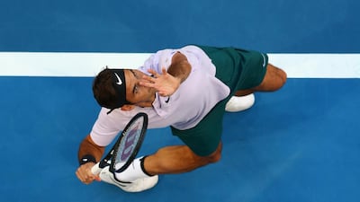Roger Federer of Switzerland serves in his 2018 Hopman Cup match against Yuichi Sugita of Japan at Perth Arena. Paul Kane / Getty Images