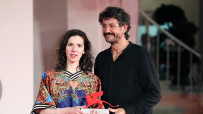 Directors Monica Stan and George Chiper-Lillemark pose with the Lion of the Future Luigi De Laurentiis Venice Award for a Debut Film for 'Imaculat'. Getty Images