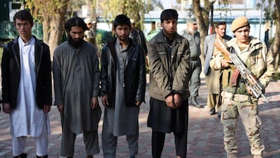 Members of the Afghan security services escort alleged members of ISIL and the Taliban, arrested during an operation in the Caperay Khar district of Nangarhar province on January 27, 2016. Ghulamullah Habibi/EPA