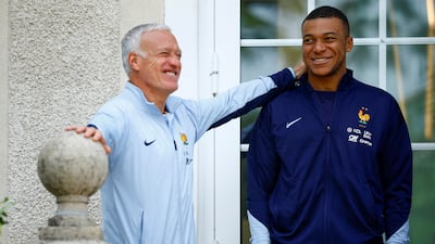 Kylian Mbappe with France manager Didier Deschamps at the national team training centre in Clairefontaine. AP