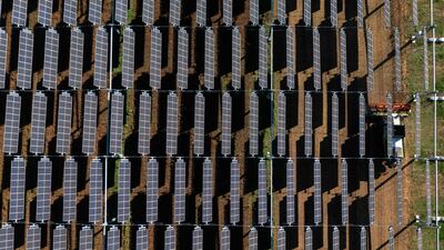 Hanging solar panels in France. Capital investment in renewables is set to hit $494 billion in 2022. AFP