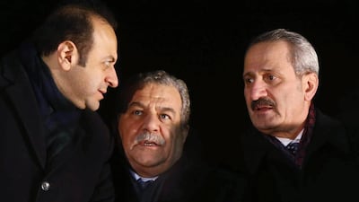 Turkey’s interior minister Muammer Guler (centre) and economy minister Zafer Caglayan (right), who have both resigned, speak to another minister, Egemen Bagis, (left) as they wait for Prime Minister Recep Tayyip Erdogan to arrive in Ankara on December 24. Adem Altan / AFP