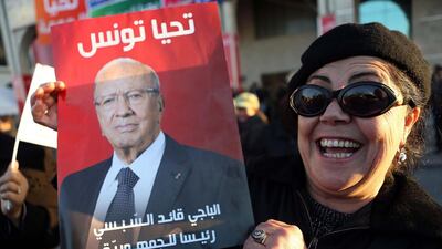 A fan of Tunisian president-elect Beji Caid Sebsi celebrates the election result. Photo: Mohamed Messara / EPA