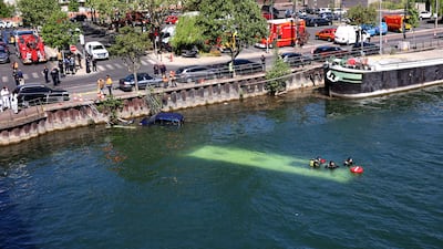 French emergency services and firefighters work as a bus with passengers fell into the River Seine in Juvisy-sur-Orge, near Paris. Reuters